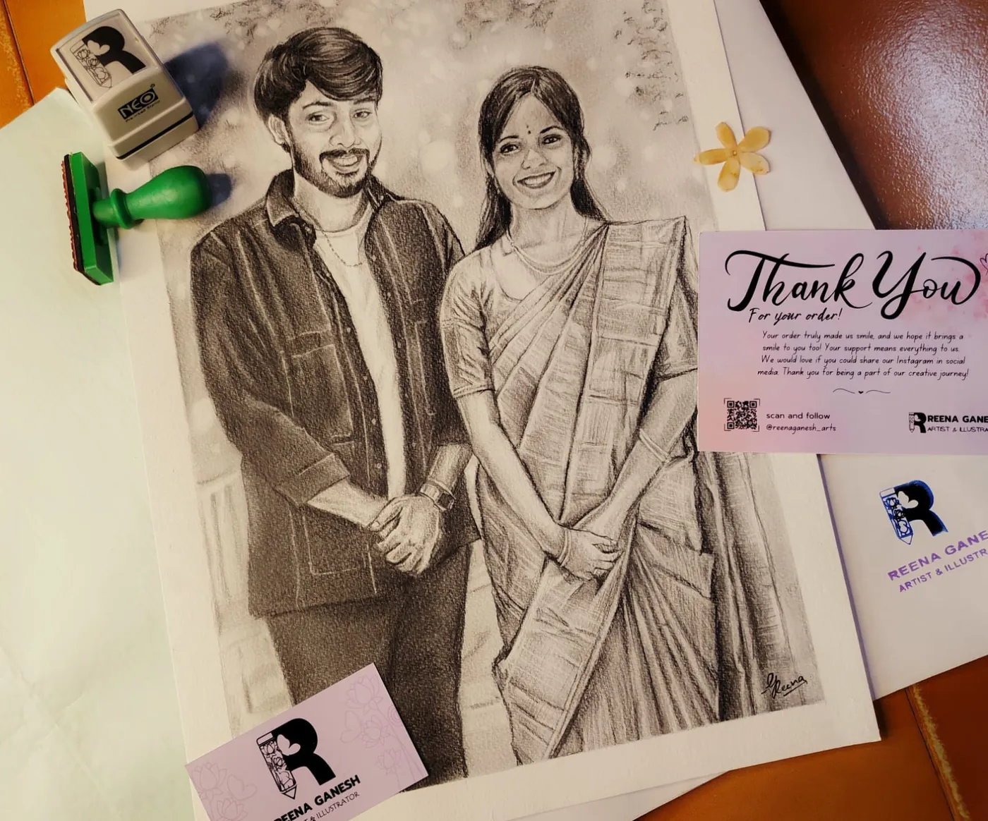 Hand-drawn pencil portrait of a couple with a Reena Ganesh thank-you card